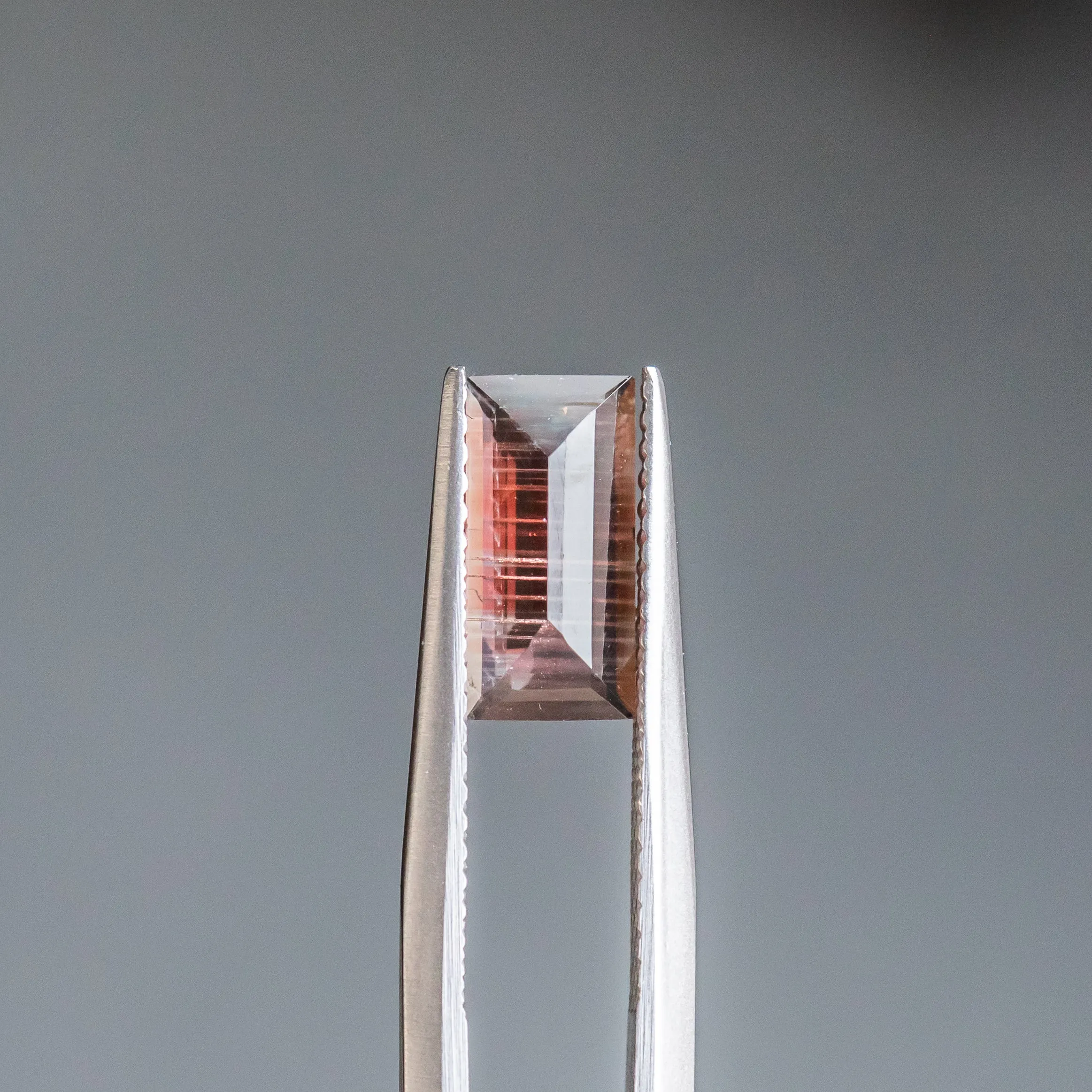 0.93CT BAGUETTE SUNSTONE, CRANBERRY RED WITH STRIPES AND SCHILLER, 9.99X4.95X2.35MM