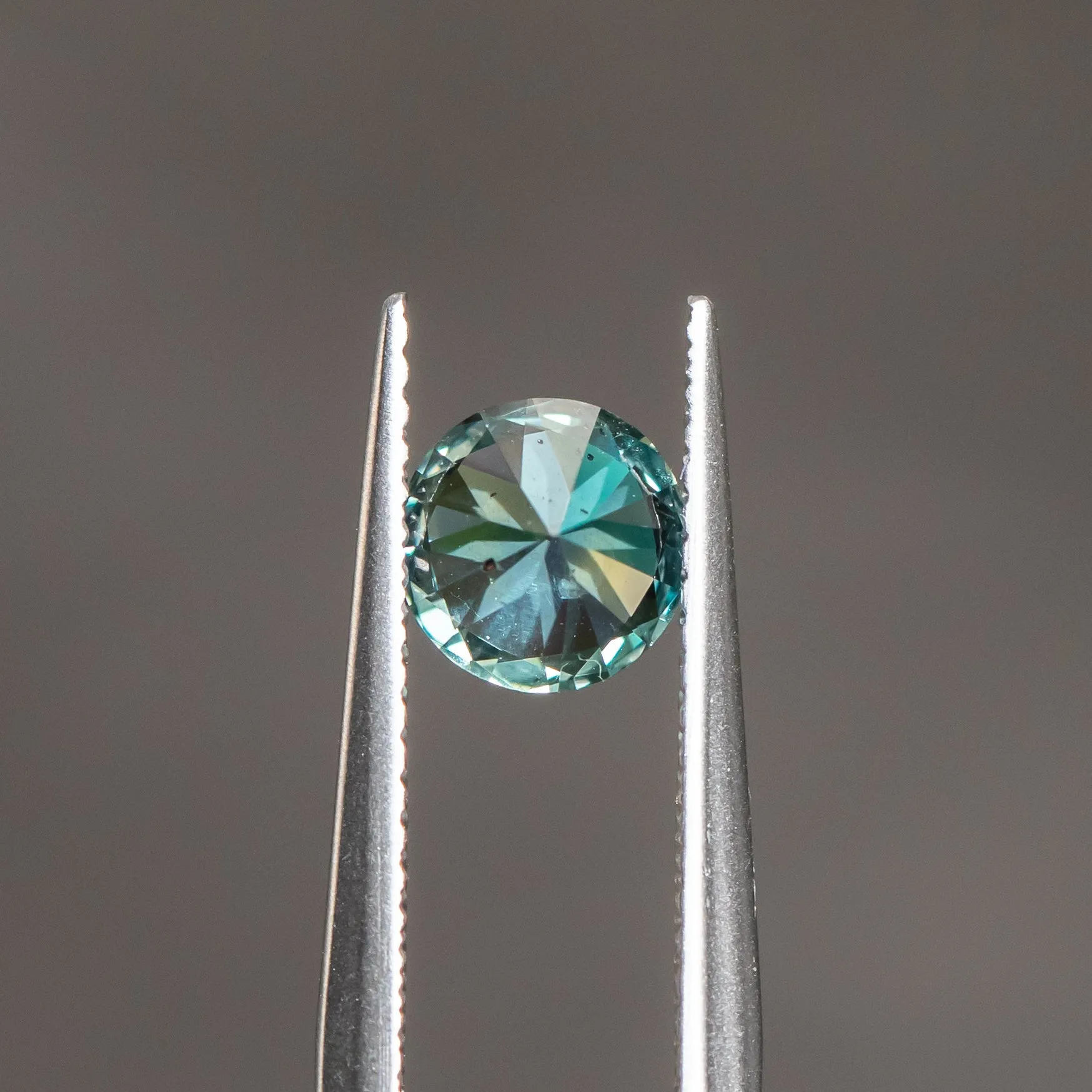 1.10CT Unheated Round Brilliant Songaea Sapphire with Color Shift from Grey/Purple to Seafoam Green - 6.21x4.08mm